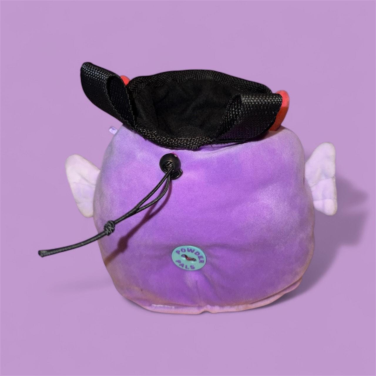 Purple Chalk bag handmade converted plush toy with devil horns, wings, and a red tail on a purple background squishmallow back view powder pals badge